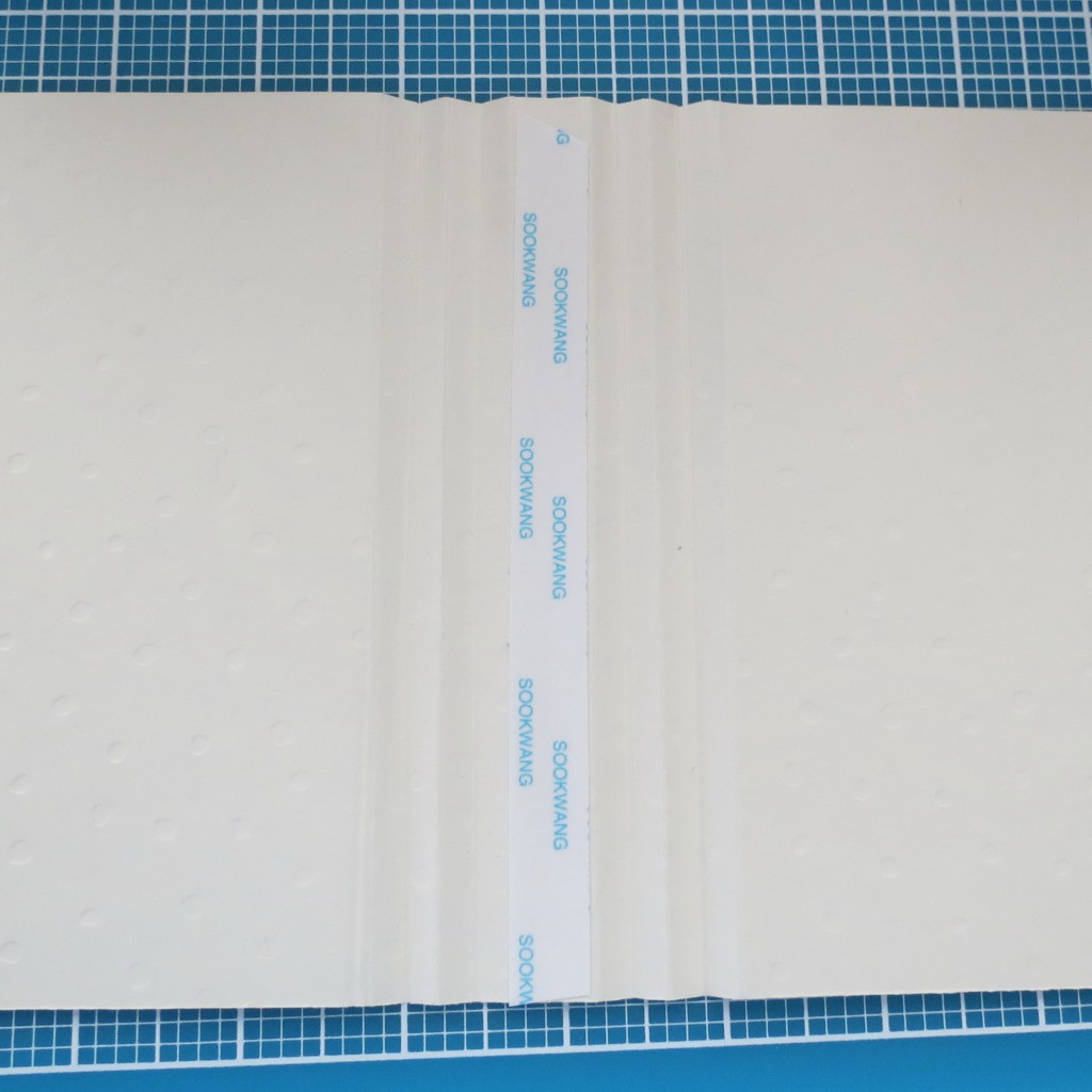 1/2" adhesive place in valley of center fold