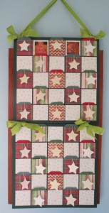 Countdown to Christmas: This banner Advent Calendar with spots for photos , pockets for tags and stars to decorate. 