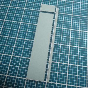 Tips for Fitting Photos to the Gird. Trimming a 1" x 4 3/8" paper tile to fit space under photo.