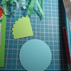 Baby Shower Scrapbook Ideas: Begin with Spellbinders Scallop and Small Circles Dies to create the baby carriage.