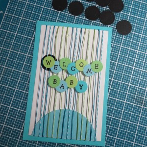 Baby Shower Scrapbook Ideas Arranging circles with letters for title on the block...testing the idea of a black circle behind each letter.